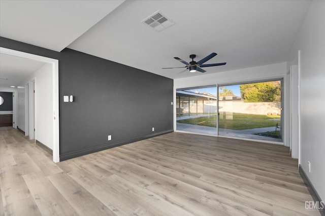 unfurnished living room with ceiling fan and light hardwood / wood-style floors