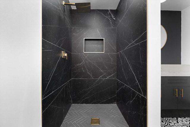 bathroom with a tile shower