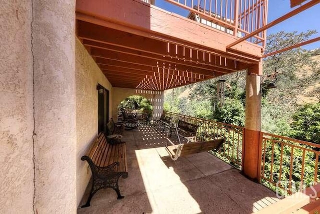 view of patio / terrace with a balcony