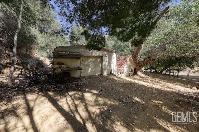 view of property exterior with a garage