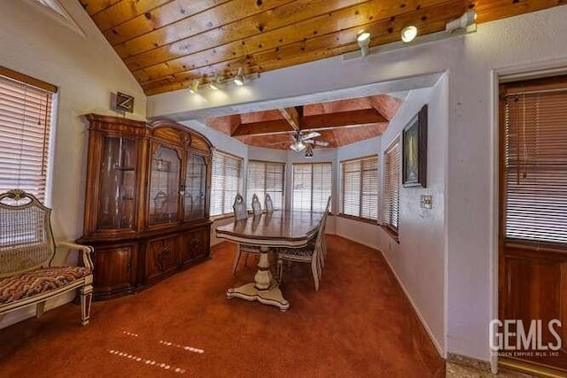 carpeted dining area featuring vaulted ceiling with beams and ceiling fan