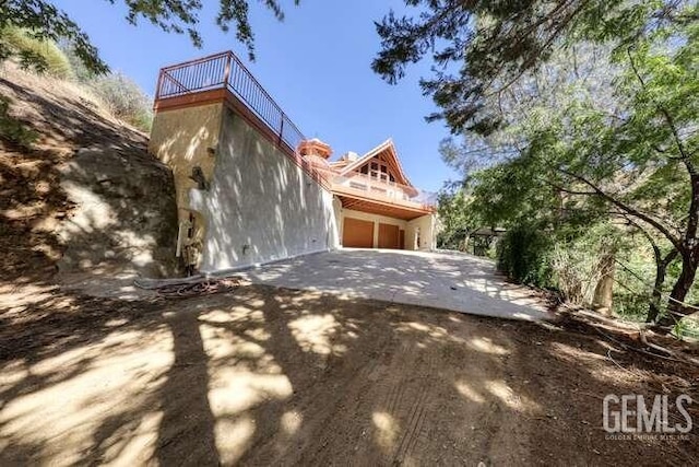 view of home's exterior with a balcony