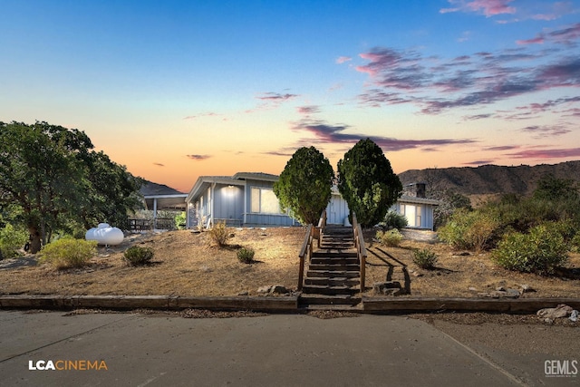 view of front of home with a mountain view