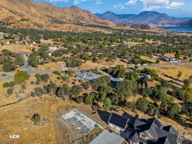 drone / aerial view featuring a mountain view