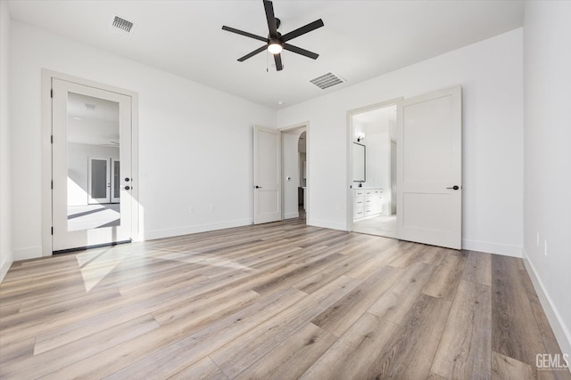 unfurnished bedroom with visible vents, baseboards, and light wood-style flooring