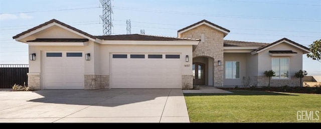 single story home featuring a front lawn, an attached garage, stone siding, and stucco siding