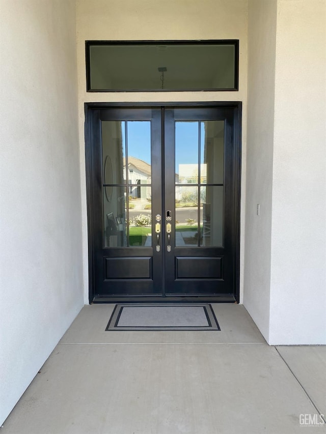 entrance to property featuring french doors