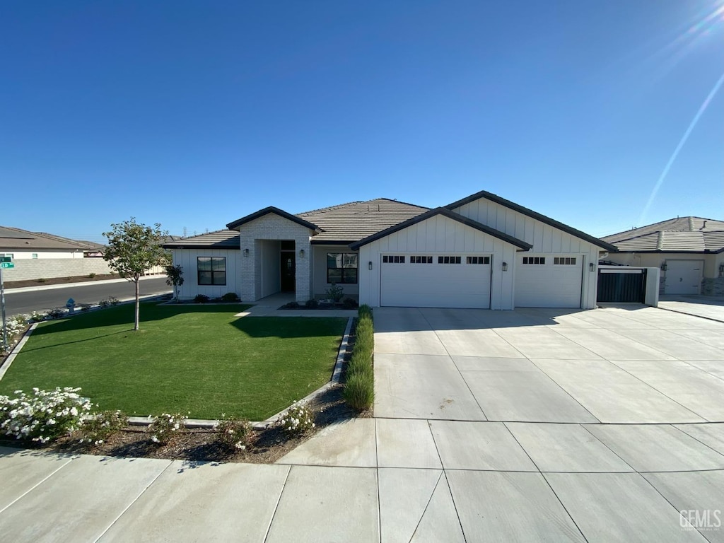 ranch-style house with a front lawn and a garage