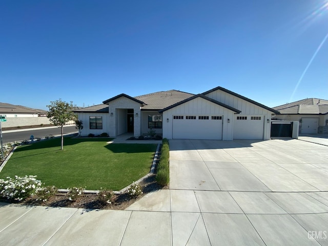 ranch-style house with a front lawn and a garage