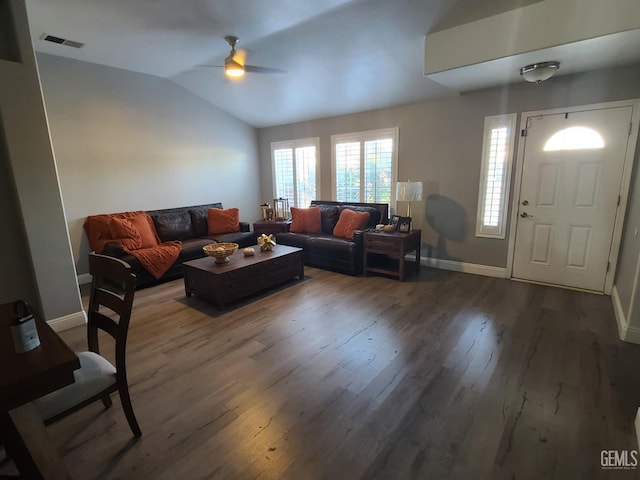 living room with hardwood / wood-style flooring, ceiling fan, and lofted ceiling