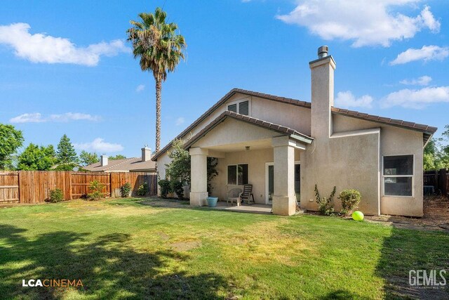 9827 Metherly Hill Rd, Bakersfield, CA 93312 - rear view of property with a chimney, stucco siding, and a patio