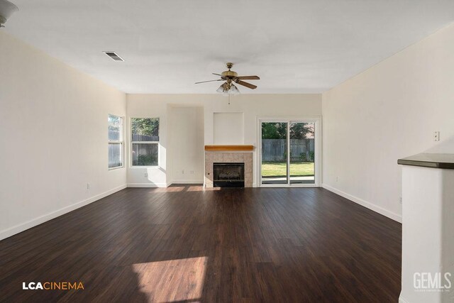 9827 Metherly Hill Rd, Bakersfield, CA 93312 - unfurnished living room with healthy amount of natural light, ceiling fan, dark wood finished floors, and baseboards