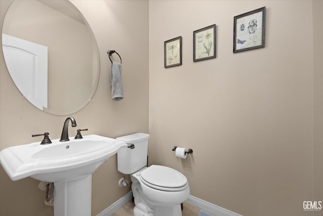 bathroom with sink and toilet