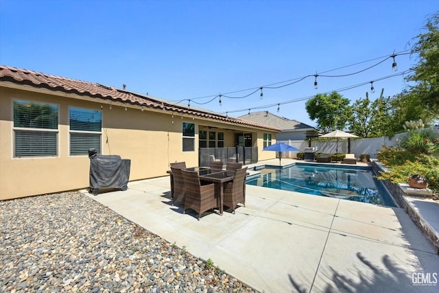 view of swimming pool featuring a patio