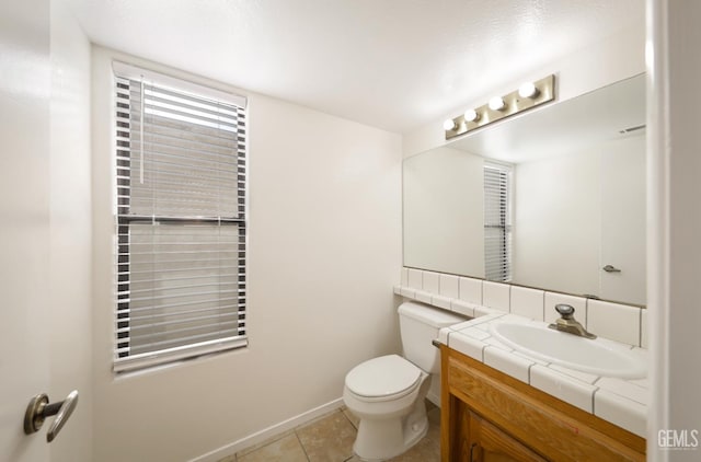 8226 Birmingham St, Bakersfield, CA 93311 - bathroom featuring vanity, tile patterned flooring, toilet, and baseboards