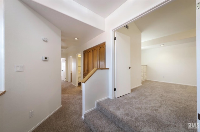 8226 Birmingham St, Bakersfield, CA 93311 - corridor with light colored carpet, recessed lighting, baseboards, and stairs