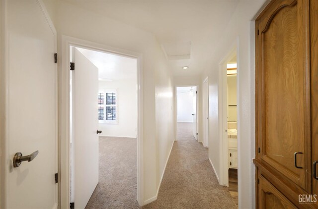 8226 Birmingham St, Bakersfield, CA 93311 - hall with light colored carpet, attic access, and baseboards