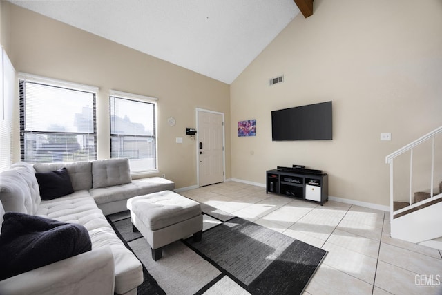 living area with high vaulted ceiling, stairway, light tile patterned flooring, and visible vents