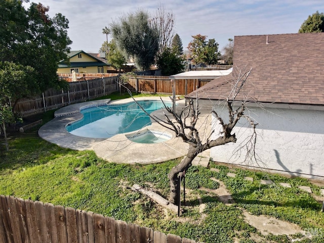 view of swimming pool featuring an in ground hot tub