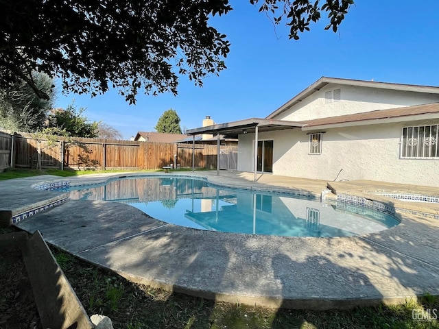 view of swimming pool with a patio