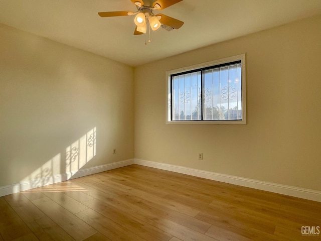 unfurnished room with ceiling fan and light hardwood / wood-style floors