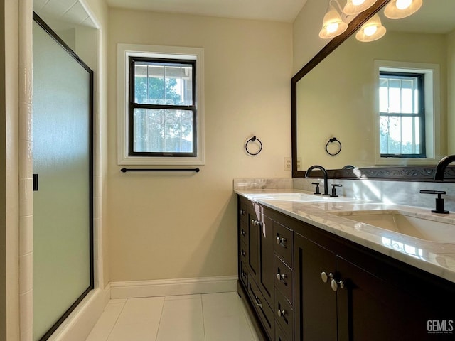 bathroom featuring tile patterned floors, vanity, and an enclosed shower