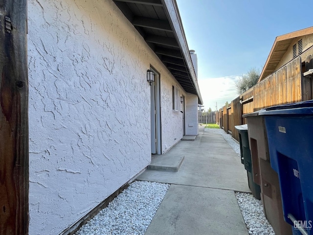 view of side of property featuring a patio