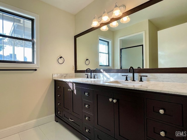 bathroom featuring tile patterned flooring and vanity