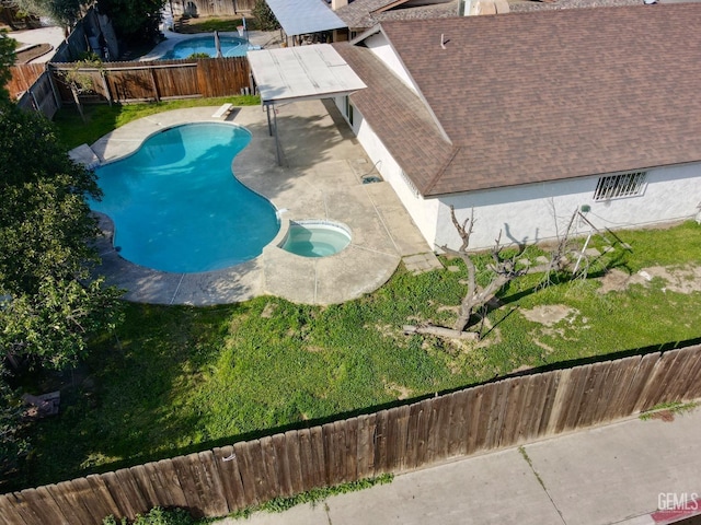 view of swimming pool with a patio area, a hot tub, and a diving board