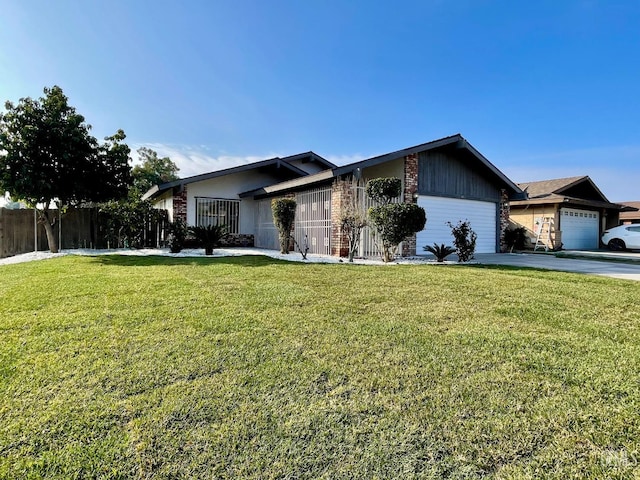 ranch-style house featuring a garage and a front lawn