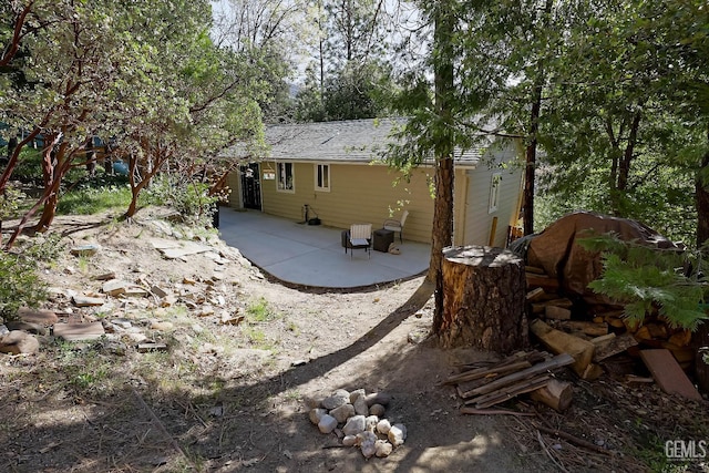 view of side of property featuring a patio