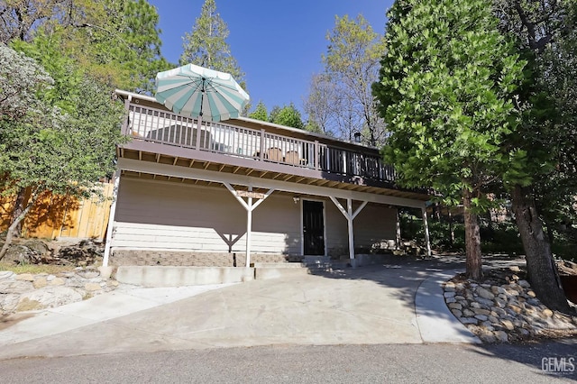 view of front of property with a wooden deck