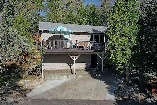 view of front of house with a wooden deck