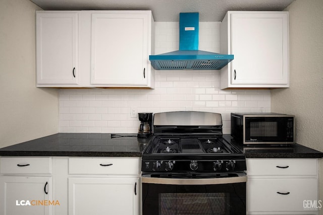 kitchen featuring white cabinets, wall chimney exhaust hood, tasteful backsplash, and stainless steel range with gas stovetop