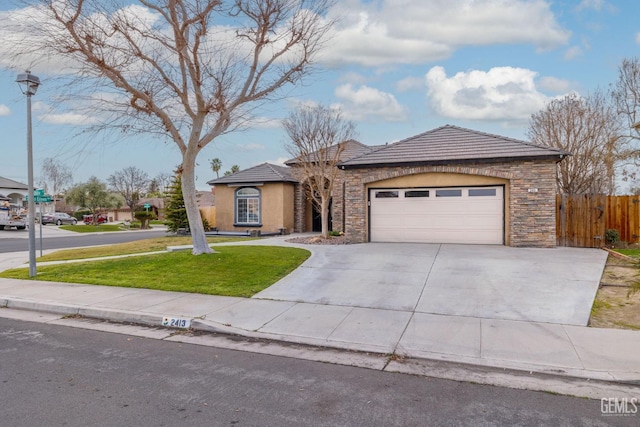 view of front facade with stone siding, driveway, an attached garage, and stucco siding