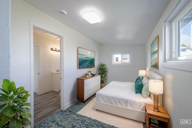 bedroom featuring wood finished floors