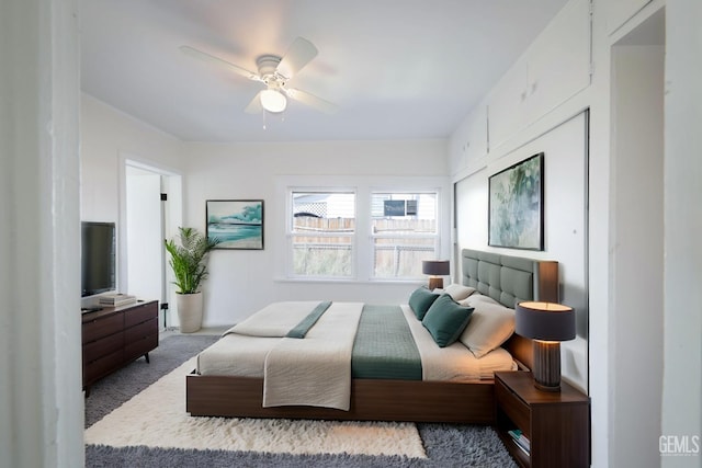 bedroom with ceiling fan and carpet