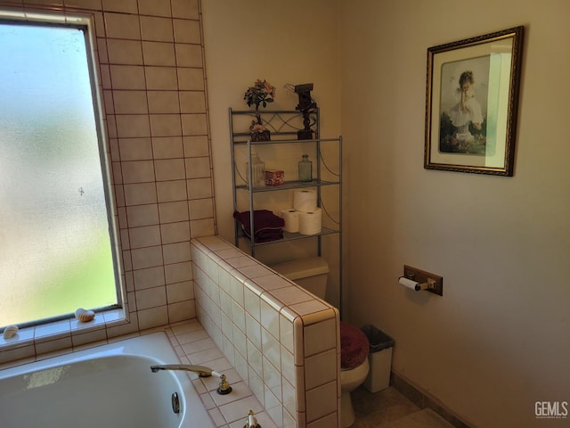 bathroom featuring a bathtub and toilet