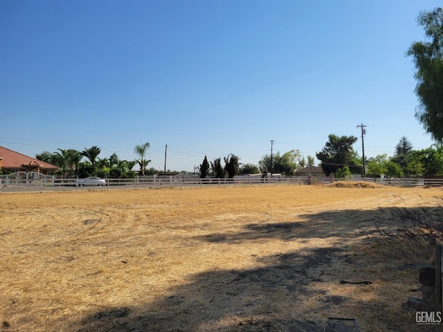 view of yard with a rural view