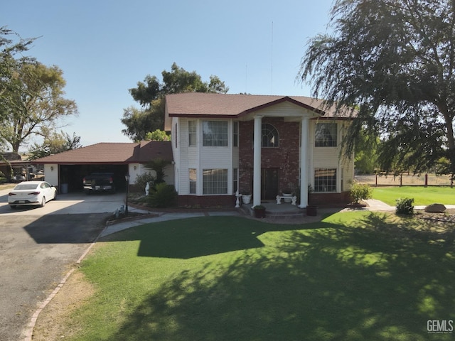 view of front of house featuring a garage and a front lawn