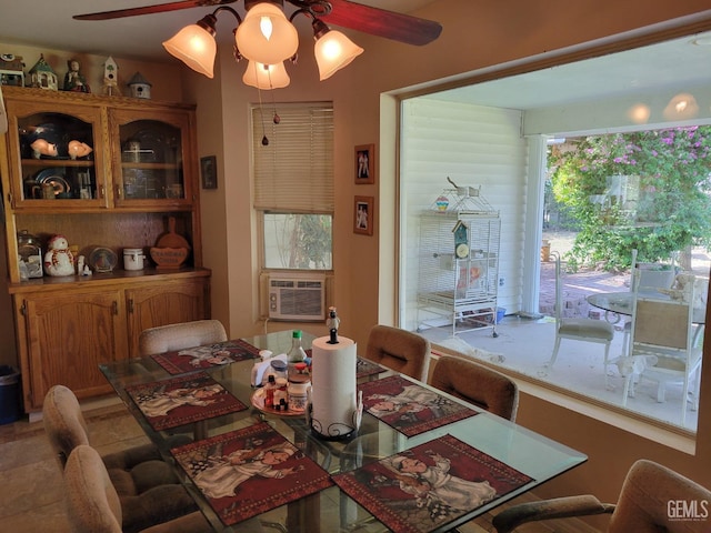 dining space with cooling unit and ceiling fan