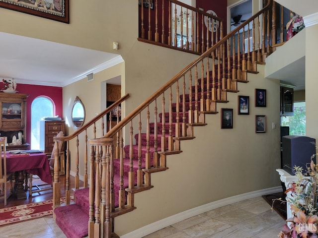 staircase with crown molding