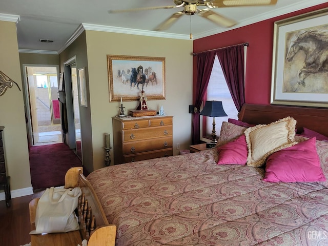 bedroom with hardwood / wood-style flooring, ceiling fan, ornamental molding, and multiple windows