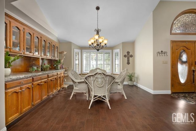 dining room with a chandelier and dark wood-type flooring