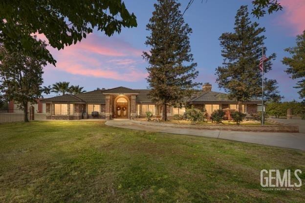 view of front of home with a yard