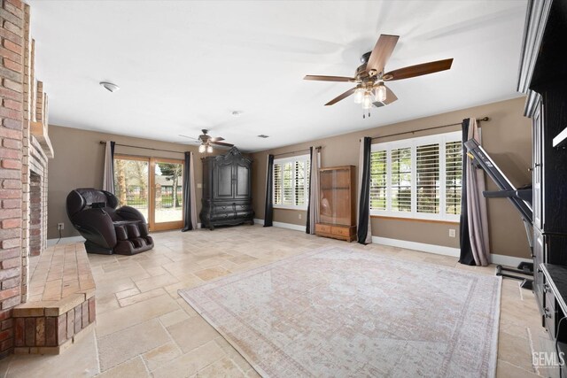 kitchen with light stone countertops, gas cooktop, light wood-type flooring, sink, and white cabinetry