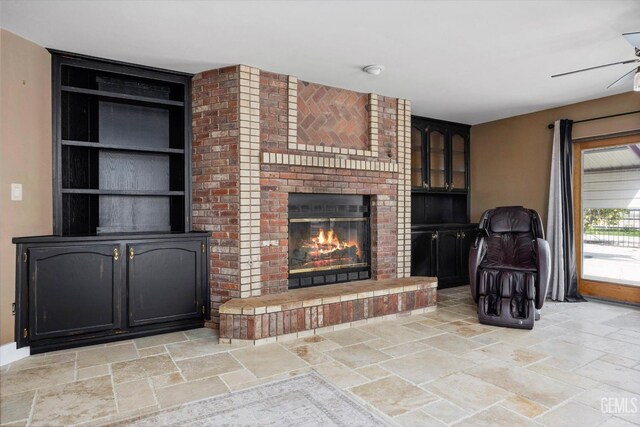 kitchen featuring ceiling fan, dark stone countertops, white cabinetry, and backsplash