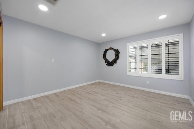 unfurnished room featuring light hardwood / wood-style floors