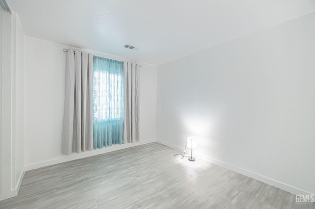 unfurnished room featuring light wood-type flooring