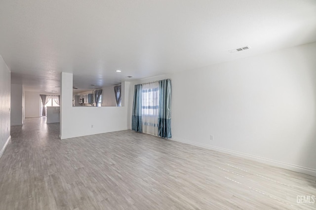 unfurnished living room with light wood-type flooring